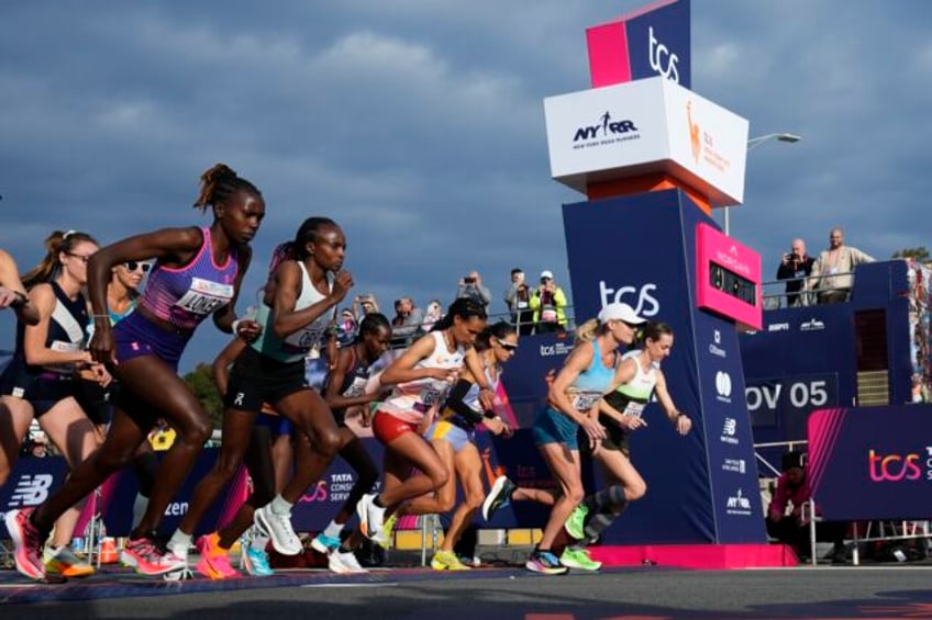 tola sets nyc marathon course record to win mens race hellen obiri of kenya takes womens title