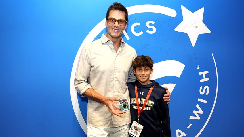 Tom Brady poses with Chris Sanchez