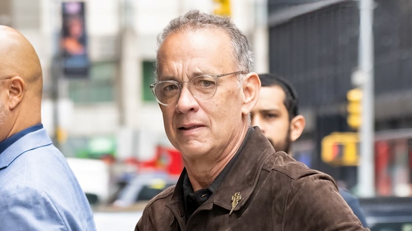 Tom Hanks walks in NYC