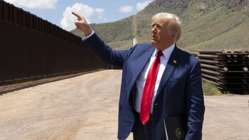 SIERRA VISTA, ARIZONA - AUGUST 22: Republican Presidential Candidate and former President Donald Trump walks along the U.S.-Mexico border on August 22, 2024 south of Sierra Vista, Arizona. Trump will hold a rally in Glendale, Arizona tomorrow. (Photo by Rebecca Noble/Getty Images)