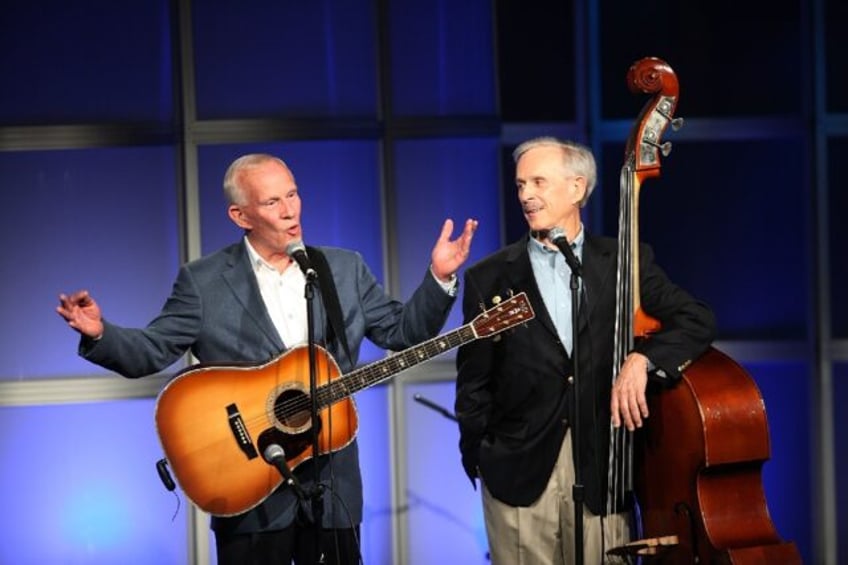 Tommy Smothers, left, has died aged 86. With his brother Dick, right, they formed the popular comedy and musical Smothers Brothers duo