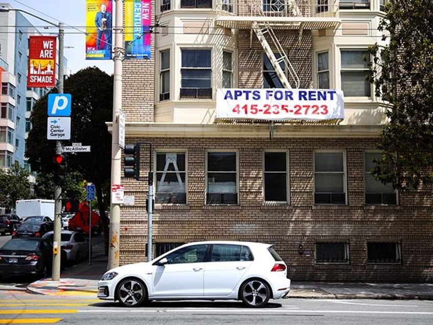 A "for rent" sign posted on the exterior of an apartment building on June 02, 2021 in San