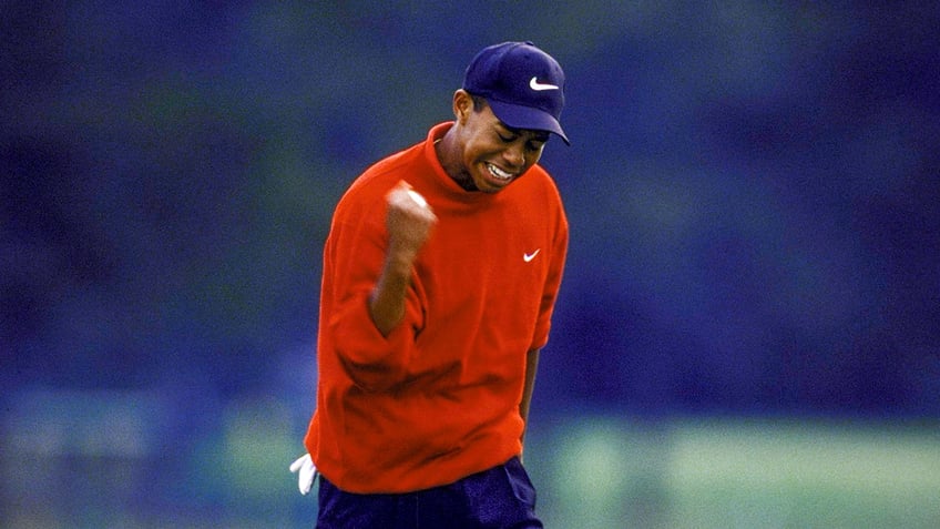 Tiger Woods celebrates shot