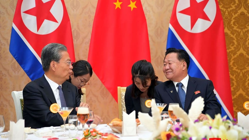 Choe Ryong Hae vice-chairman of the central committee of the Workers' Party of North Korea, talks with Zhao Leji, chairman of the National People’s Congress of China