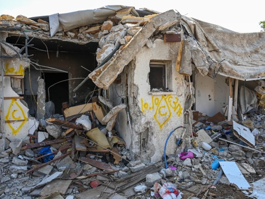 KFAR AZA, ISRAEL - OCTOBER 10: A view of a house left in ruins after an attack by Hamas militants on this kibbutz days earlier when dozens of civilians were killed near the border with Gaza, on October 10, 2023 in Kfar Aza, Israel. Israel has sealed off Gaza and conducted airstrikes on Palestinian territory after an attack by Hamas killed hundreds and took more than 100 hostages. On October 7, the Palestinian militant group Hamas launched a surprise attack on Israel from Gaza by land, sea, and air, killing over 700 people and wounding more than 2000. Israeli soldiers and civilians have also been taken hostage by Hamas and moved into Gaza. The attack prompted a declaration of war by Israeli Prime Minister Benjamin Netanyahu, and ongoing retaliatory strikes by Israel on Gaza killing hundreds. (Alexi J. Rosenfeld/Getty Images)