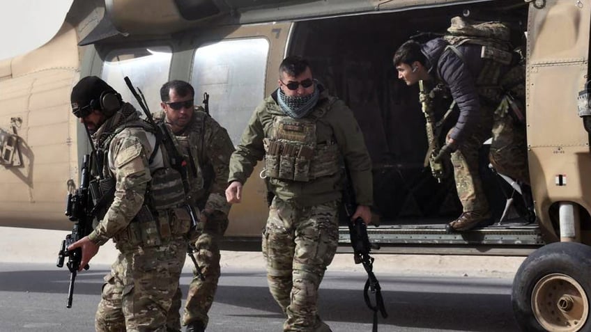 Former Afghan Lt. General Sami Sadat exits a helicopter during U.S. War on Terror.