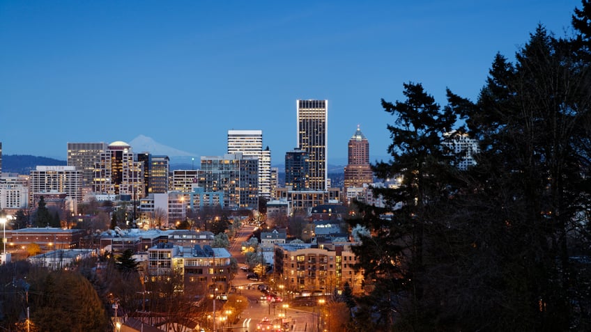 Portland, Oregon skyline at night with city lights illuminating photo