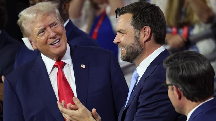 Donald Trump and JD Vance react during Day 1 of the Republican National Convention