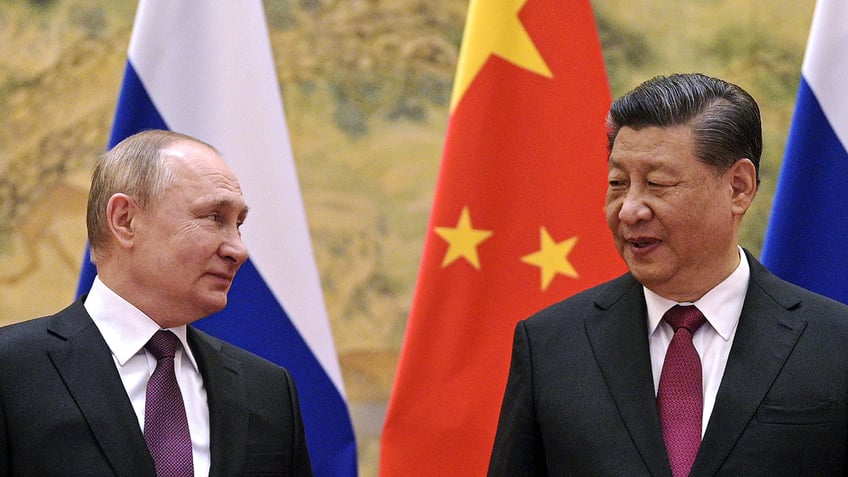 Vladimir Putin and Xi Jinping meet in China