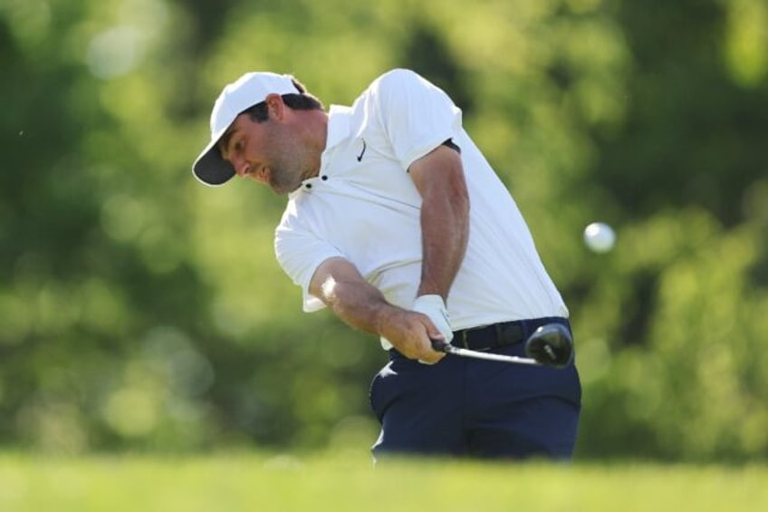 Top-ranked Scottie Scheffler of the United States fired a four-under par 68 to grab a thre