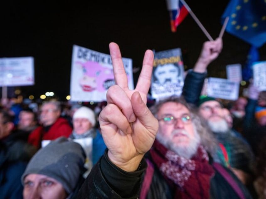 People take part in an anti-government protest at the Freedom Square organized by politica