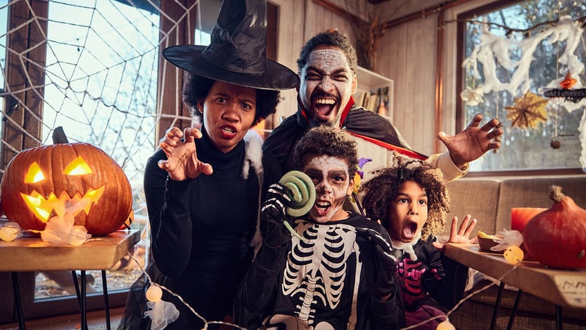 Family in Halloween costumes