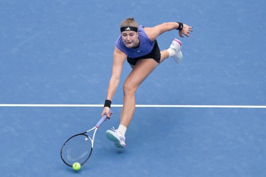 Czech Republic’s Karolina Muchova hits a return to Belarus's Aryna Sabalenka during thei