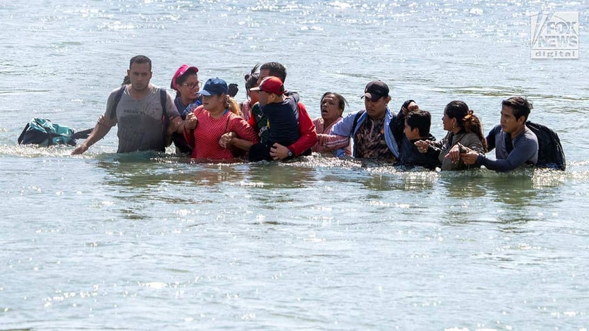 Migrants cross the Rio Grande River to enter the American Border