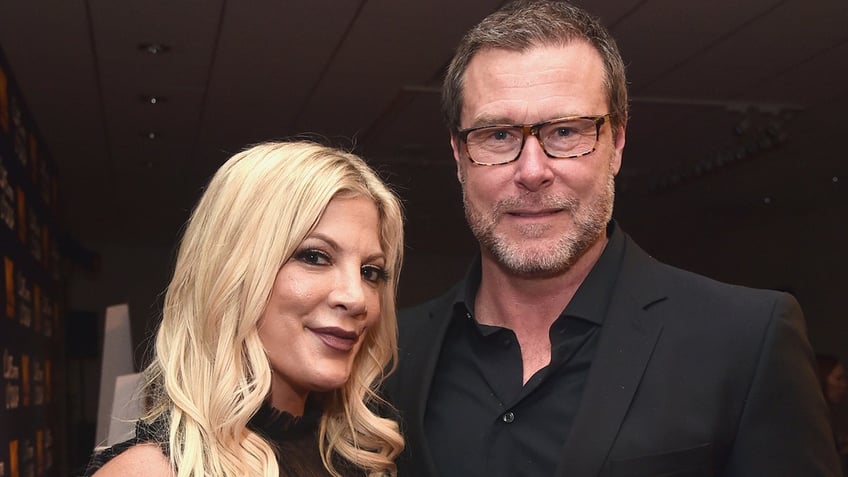 TV star Tori Spelling wears black dress at event with Dean McDermott