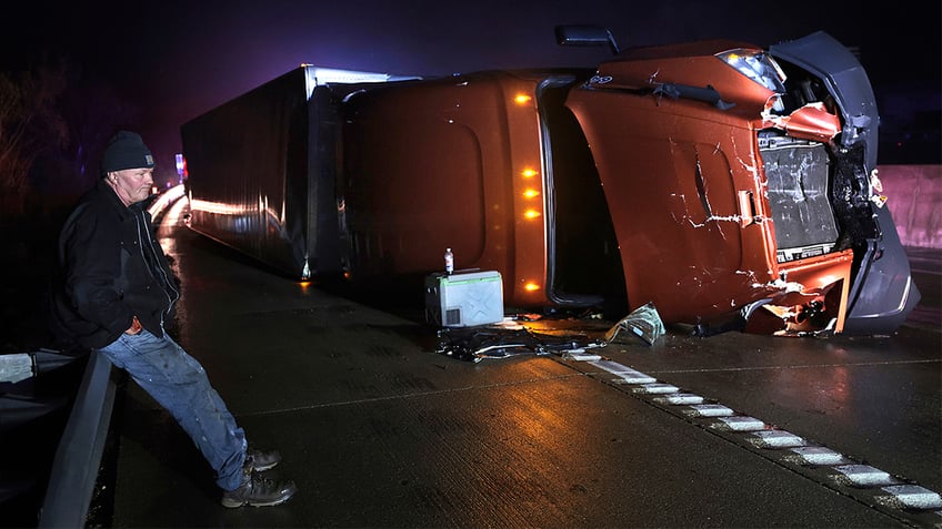 Mark Nelson, of Wisconsin, waits with his tractor-trailer