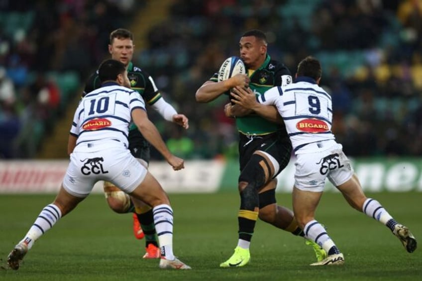 Juarno Augustus runs at Castres half backs Santiago Arata Perrone and Louis le Brun