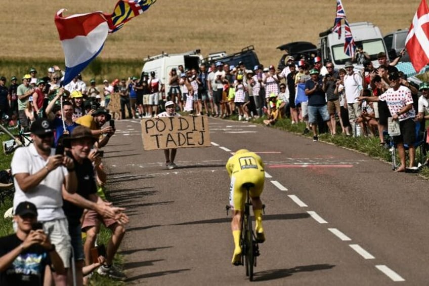 Tadej Pogacar cuts a popular figure along the route of the Tour de France