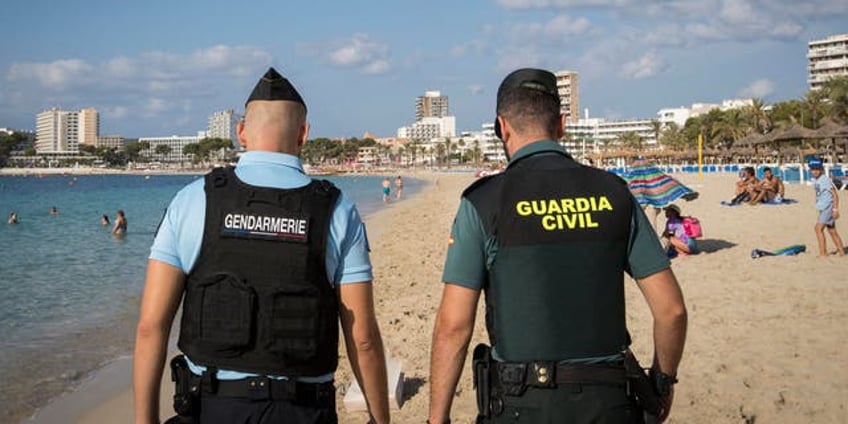 tourist gang raped at spanish resort while attackers filmed assault report