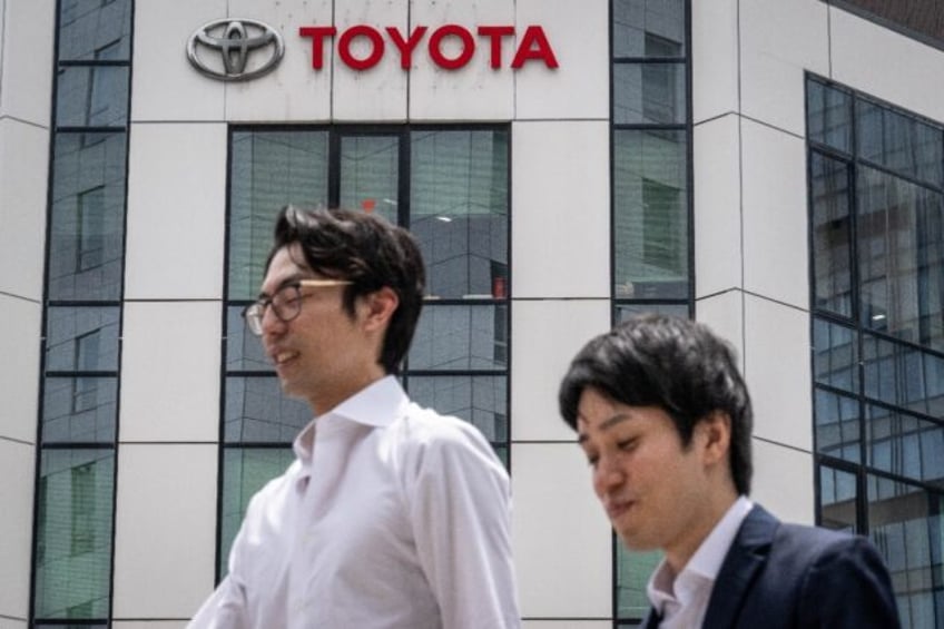 Toyota's unit sales were hit by production cuts in Japan related to certification issues