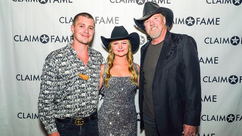 Country star Trace Adkins wears matching cowboy hats with daughter Mackenzie alongside Hud Mellencamp.