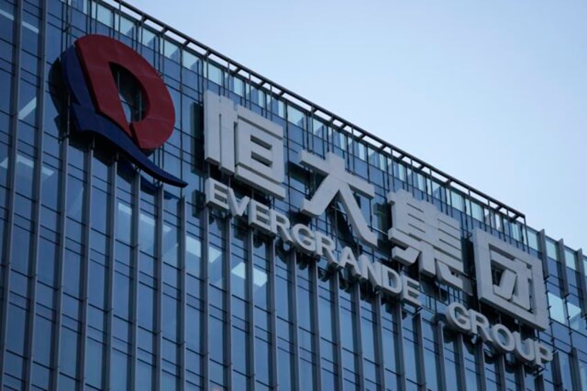 trading of shares of heavily indebted property developer china evergrande suspended in hong kong