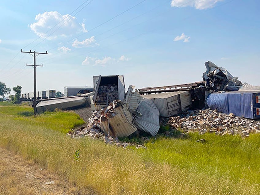 train derailed in montana with cars spilling carrots napkins and cake mix