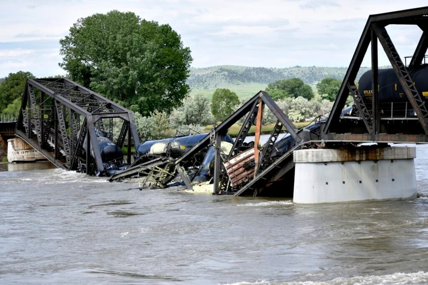 train derailed in montana with cars spilling carrots napkins and cake mix