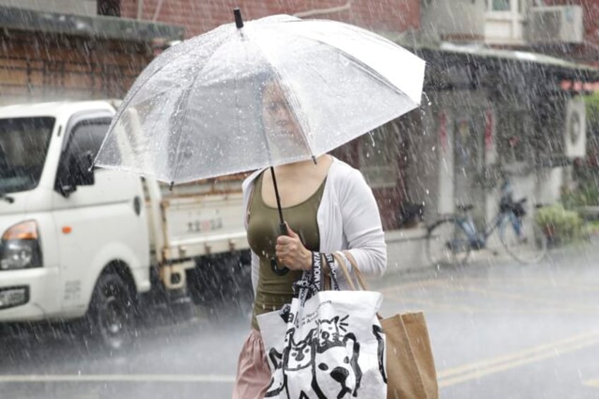 trains suspended people warned away from the coastline as typhoon saola churns toward south china