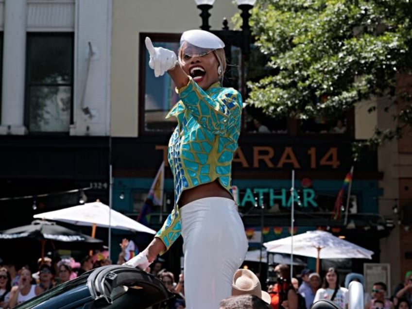 WASHINGTON, DC - JUNE 07: Laverne Cox waves as her vehicle makes its way along the parade