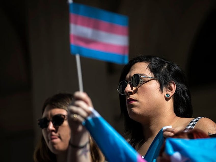 NEW YORK, NY - OCTOBER 24: L.G.B.T. activists and their supporters rally in support of tra