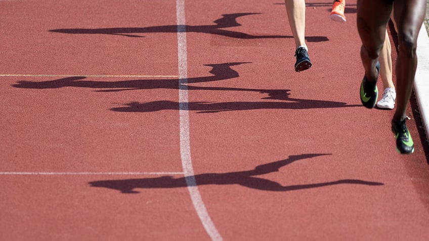 Runners on a race track