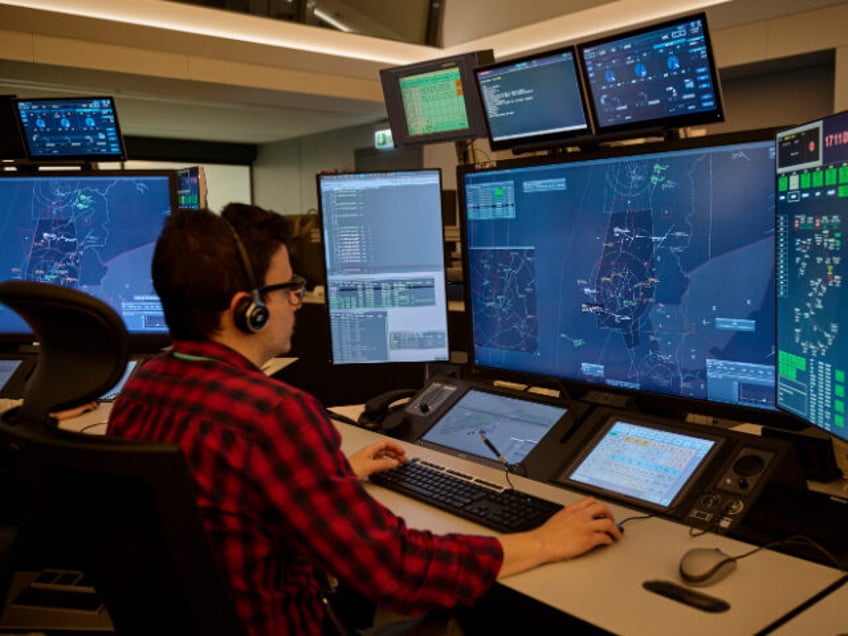 NAV Portugal air traffic controllers seen at work in its HQs next to Lisbon International