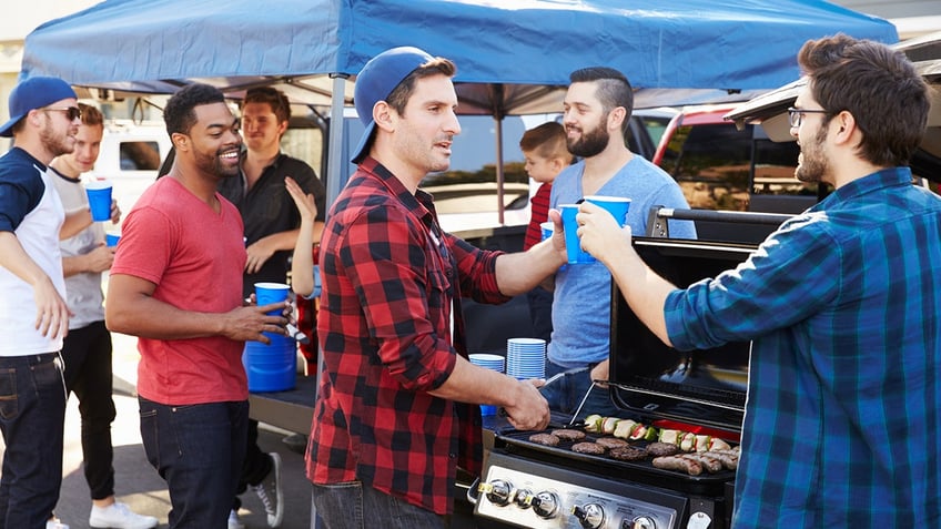 group of football fans tailgating