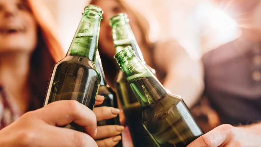 beer bottle cheers at tailgate