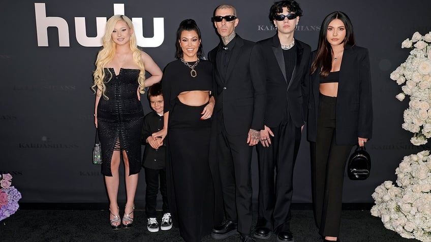 From left to right, Alabama Barker, Reign Disick, Kourtney Kardashian, Travis Barker, Landon Barker and Atiana De La Hoya in 2022.