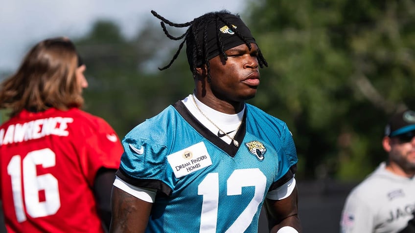 Travis Hunter runs on field