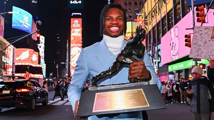 Travis Hunter holds the Heisman Trophy