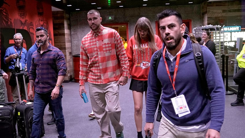 travis kelce and taylor swift exit chiefs stadium hand in hand after dominant win over chargers