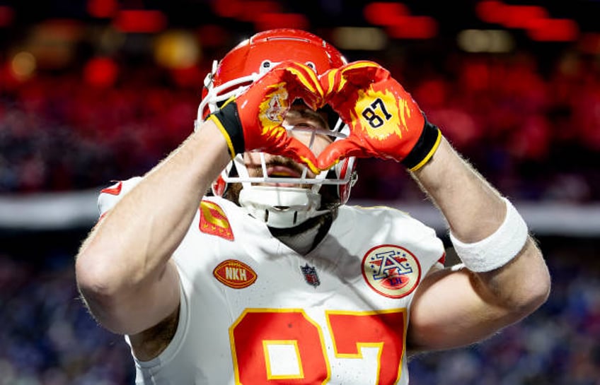 Travis Kelce of the Kansas City Chiefs celebrates after scoring a 22 yard touchdown against the Buffalo Bills during the second quarter in the AFC...