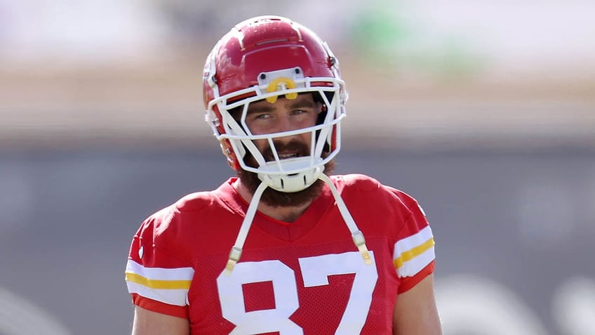 Travis Kelce looks on practice field