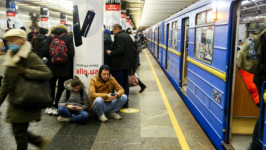 People take shelter in a metro station in Kyiv, Ukraine on February 24, 2022. Air raid sirens rang out in downtown Kyiv today as cities across Ukraine were hit with what Ukrainian officials said were Russian missile strikes and artillery. (Photo by VIACHESLAV RATYNSKYI/Anadolu Agency via Getty Images)