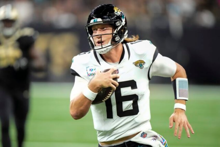 trevor lawrence comes through late and the jaguars hold off the saints 31 24