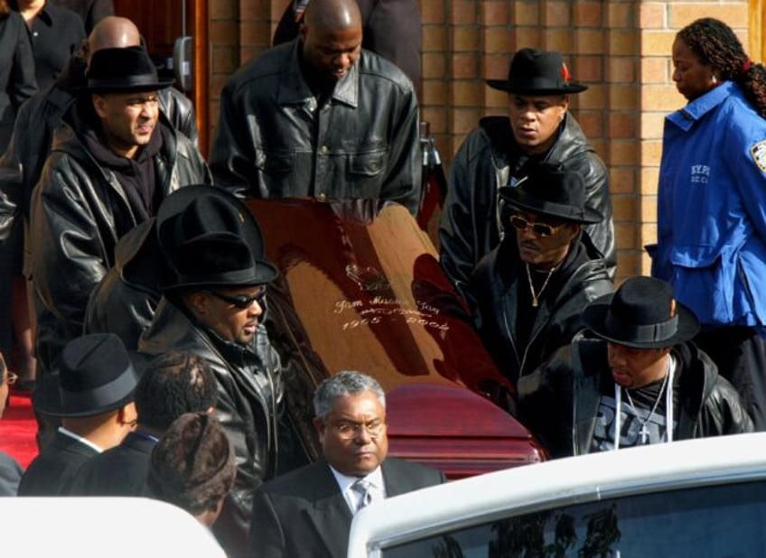 The coffin of Run-DMC's Jam Master Jay, the rapper born Jason Mizell, is carried out of a Queens Cathedral after his funeral in November 2002