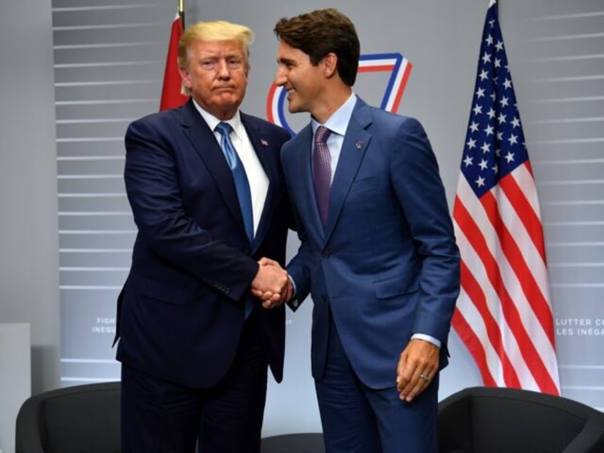 US President Donald Trump and Canada's Prime Minister Justin Trudeau shakes hands during a