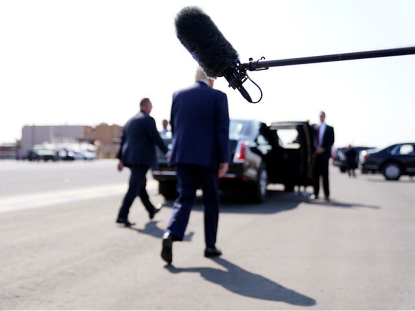 President Donald Trump walks from the microphone at Phoenix Sky Harbor International Airpo