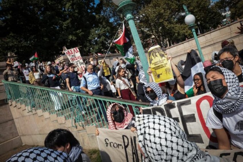 Pro-Palestinian demonstrators march through Columbia University's campus in New York in Oc