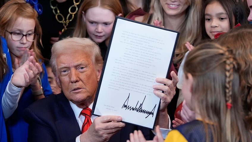 Donald Trump signs the executive order