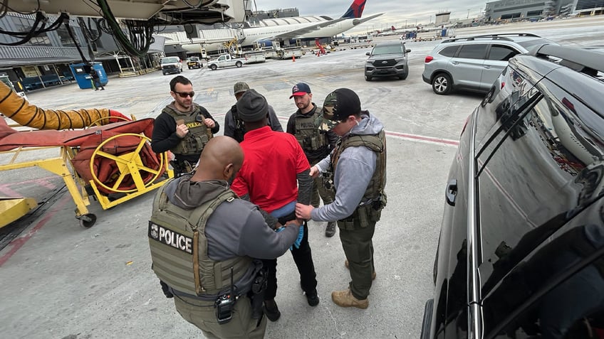 A man accused of immigration crime is on an Atlanta tarmac awaiting a deportation flight