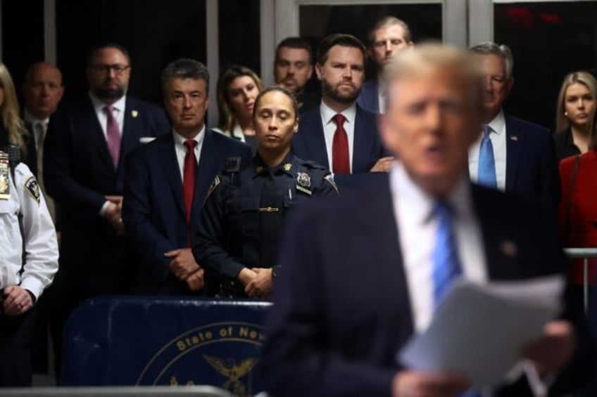 Senator JD Vance (center, red tie), Senator Tommy Tuberville (back right, blue tie) and Er